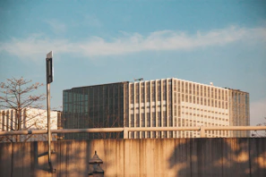 Modern portable office cabin set against a Qatar industrial backdrop under clear skies.