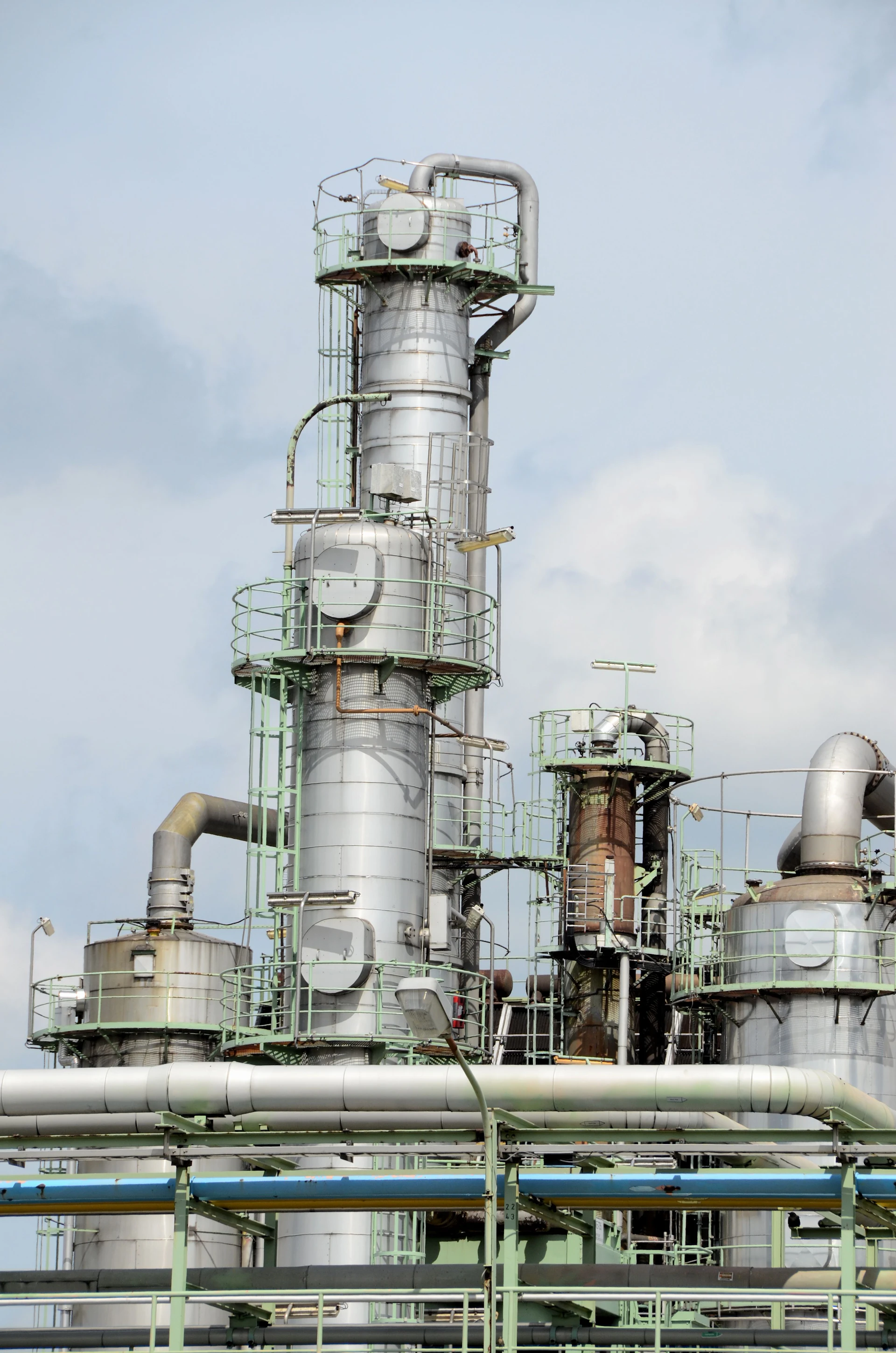 Oil and gas industrial plant infrastructure under a clear sky