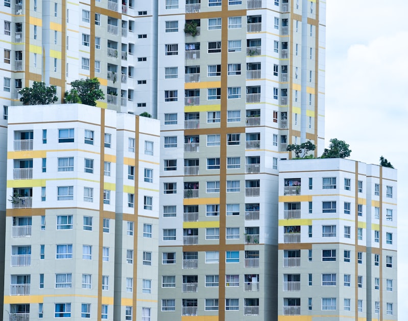 Densely packed high-rise apartment buildings in Ho Chi Minh City seen from street level, illustrating the scale of Vietnam's urban rental market