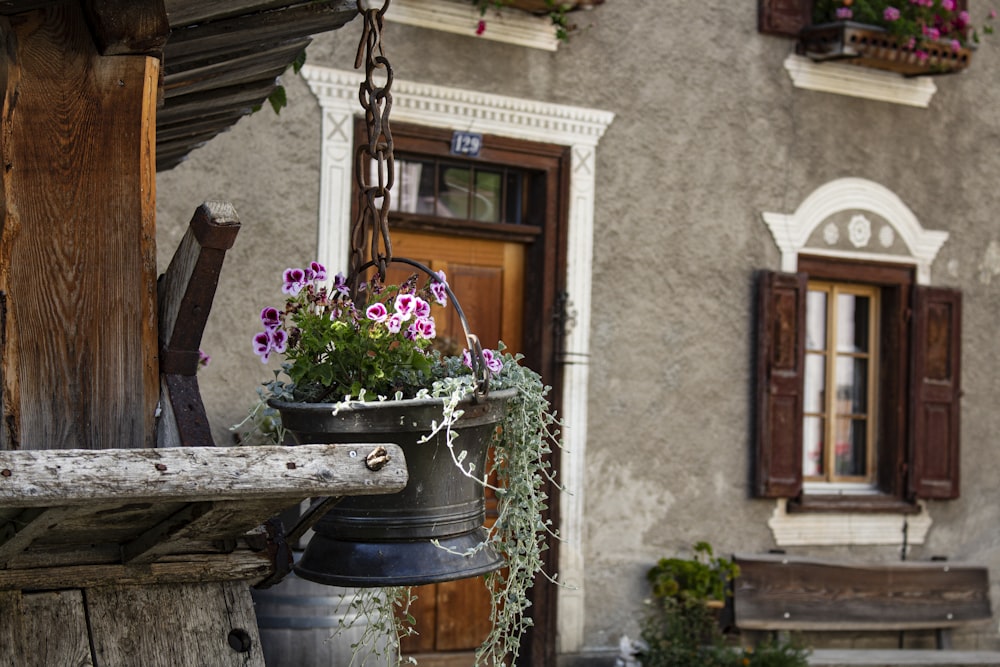 brown wooden barrel with flowers