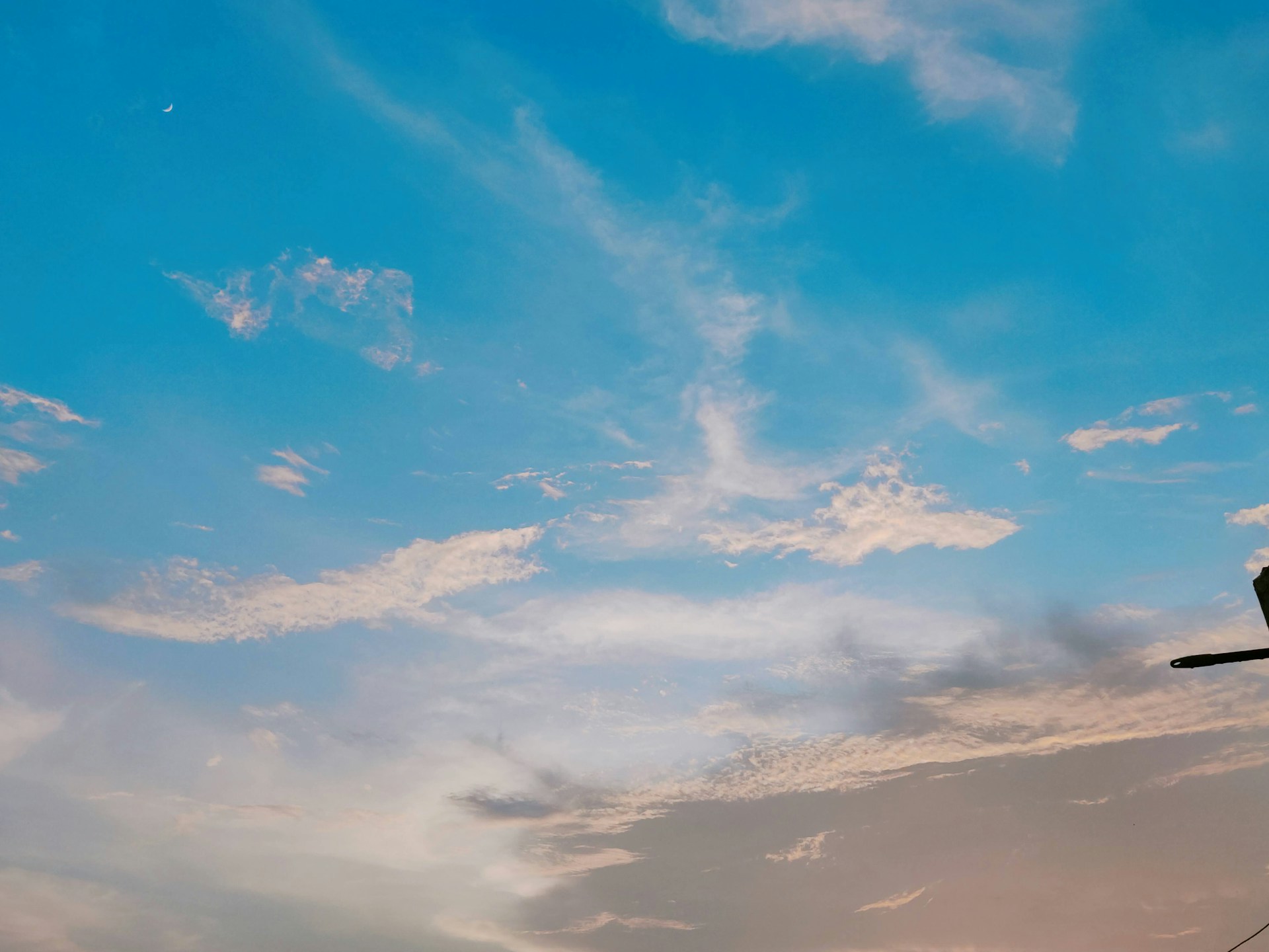A still from a classic film showing a serene blue sky backdrop, evoking calm and nostalgia.