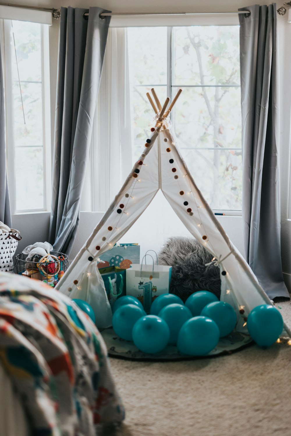 blue and green balloons on white metal rack