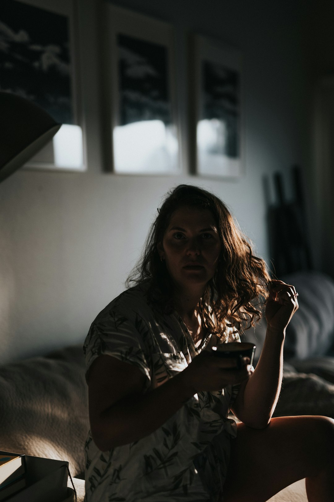 woman in brown t-shirt sitting on couch