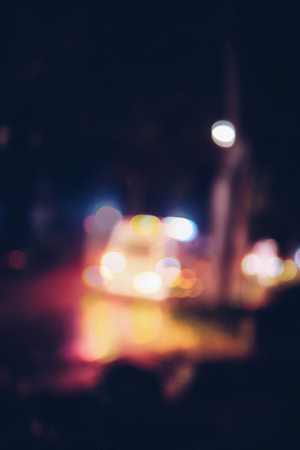 yellow car on road during night time