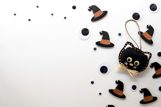 A collection of digital art featuring playful black cats.