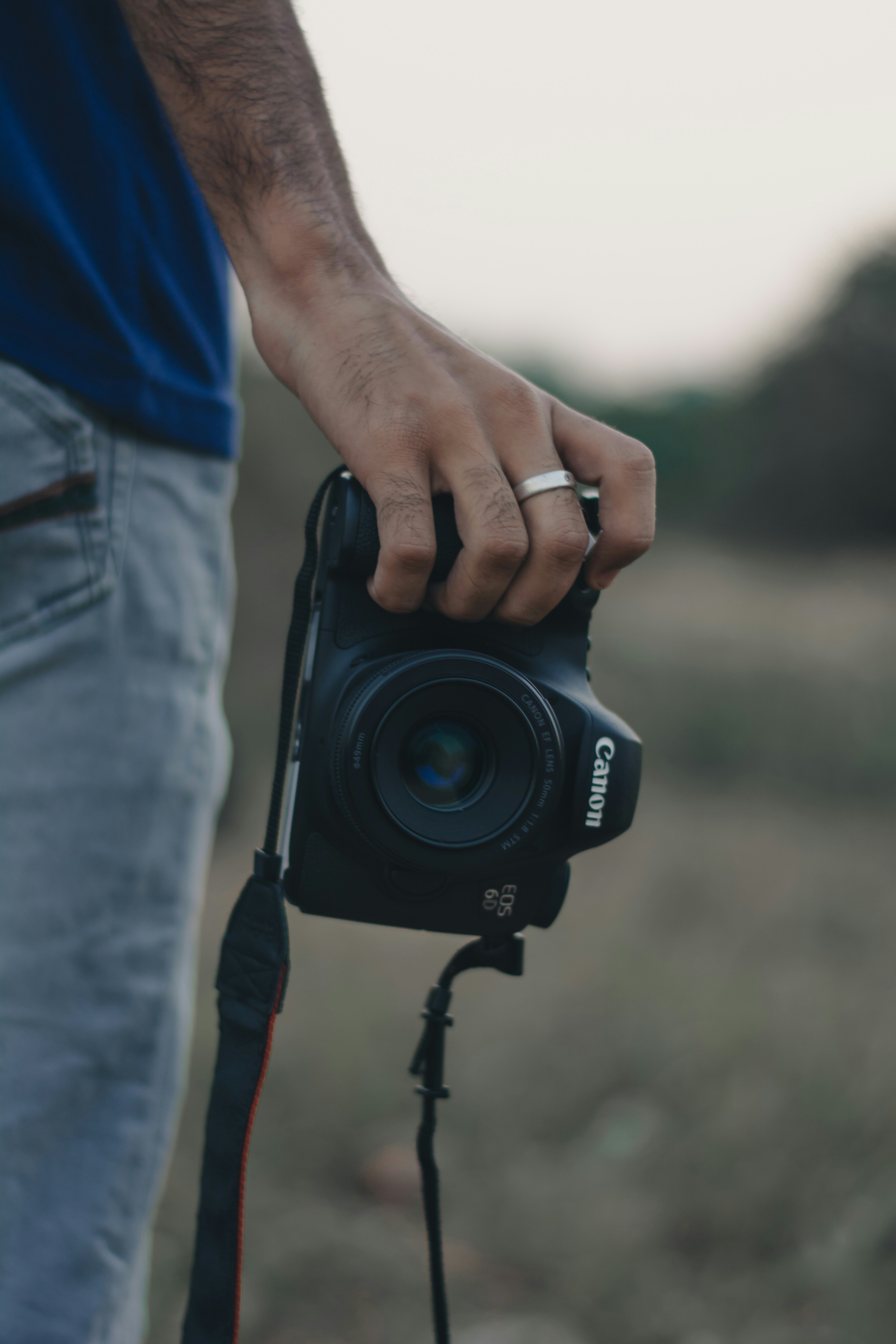 person holding black nikon dslr camera