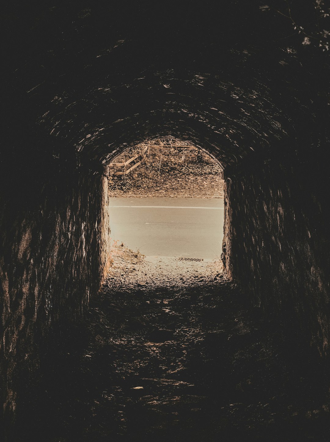 brown tunnel with white sand during daytime