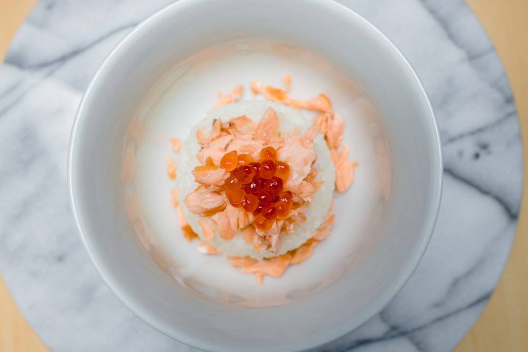 white ceramic bowl with orange powder