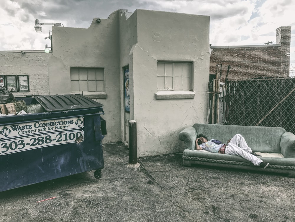 man lying on blue bed