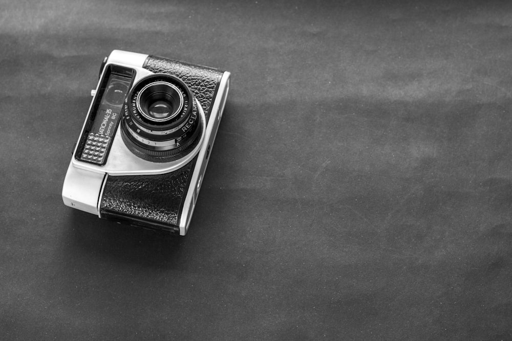 black and silver point and shoot camera