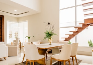 white and brown wooden table and chairs