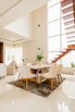 white and brown wooden table and chairs