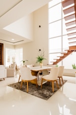 white and brown wooden table and chairs