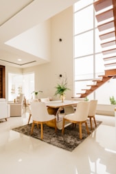white and brown wooden table and chairs
