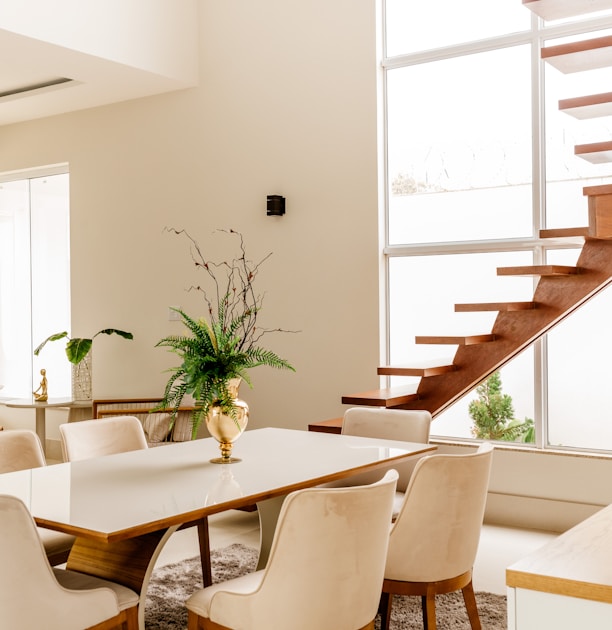 white wooden table with chairs