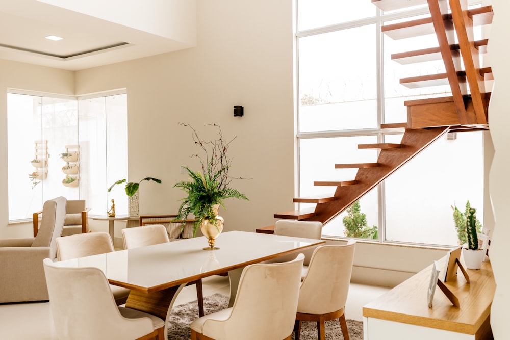 white wooden table with chairs