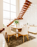 white wooden table with chairs