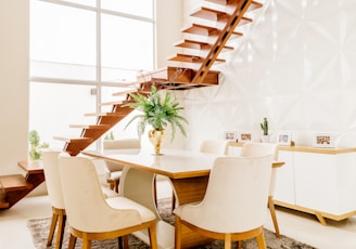 white wooden table with chairs