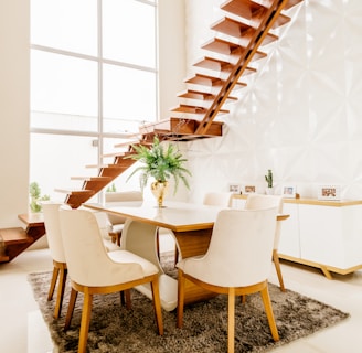 white wooden table with chairs