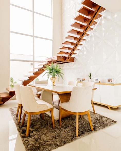 white wooden table with chairs