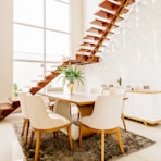 white wooden table with chairs