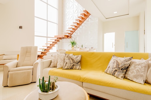 white couch and white throw pillows