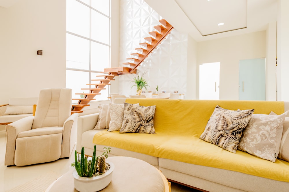 white couch and white throw pillows