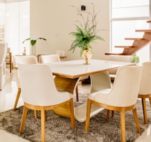 white wooden table with chairs