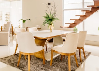 white wooden table with chairs