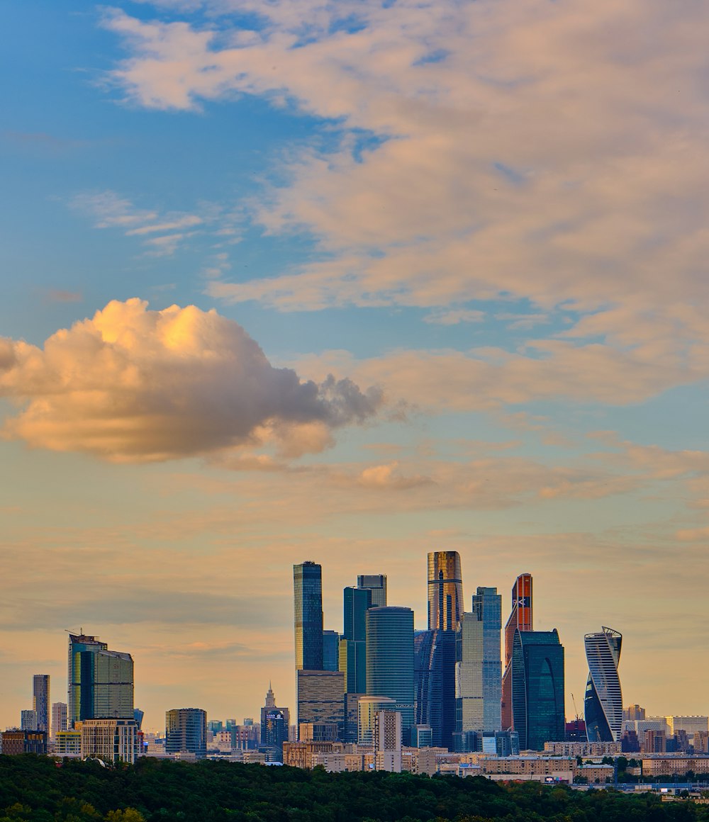 city skyline under cloudy sky during daytime