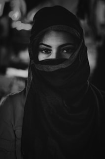 grayscale photo of woman wearing hijab