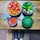Smiling man unpacking fresh produce at his kitchen table