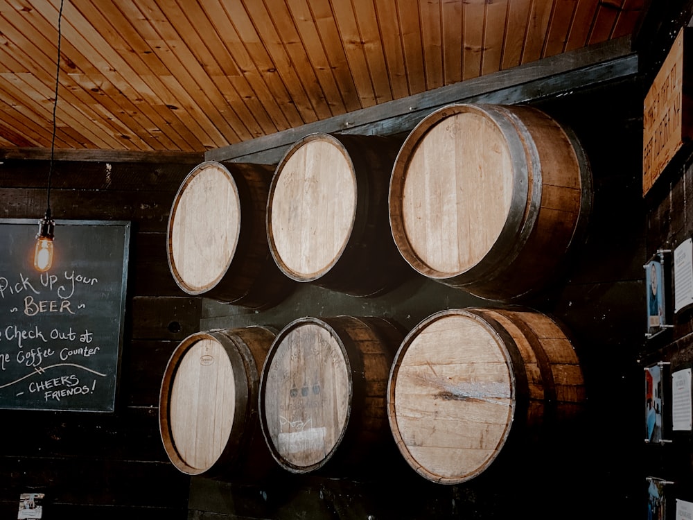brown wooden barrels in a dark room