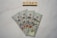 Five one-hundred dollar bills are fanned out on a marble surface. Above them, Scrabble tiles spell out the word 'MONEY'.