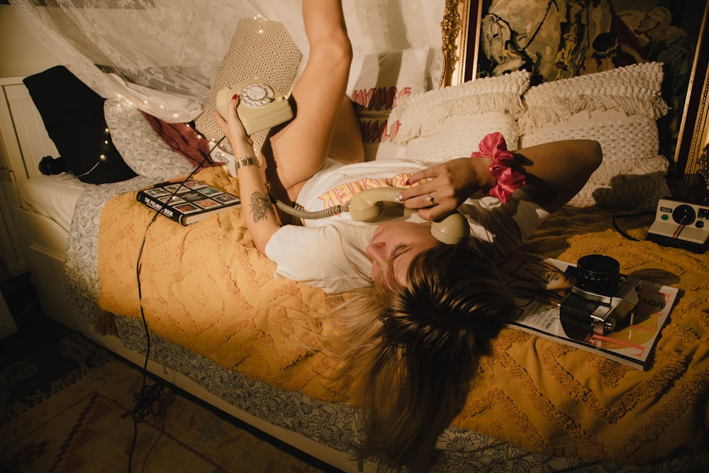 woman in white dress lying on bed