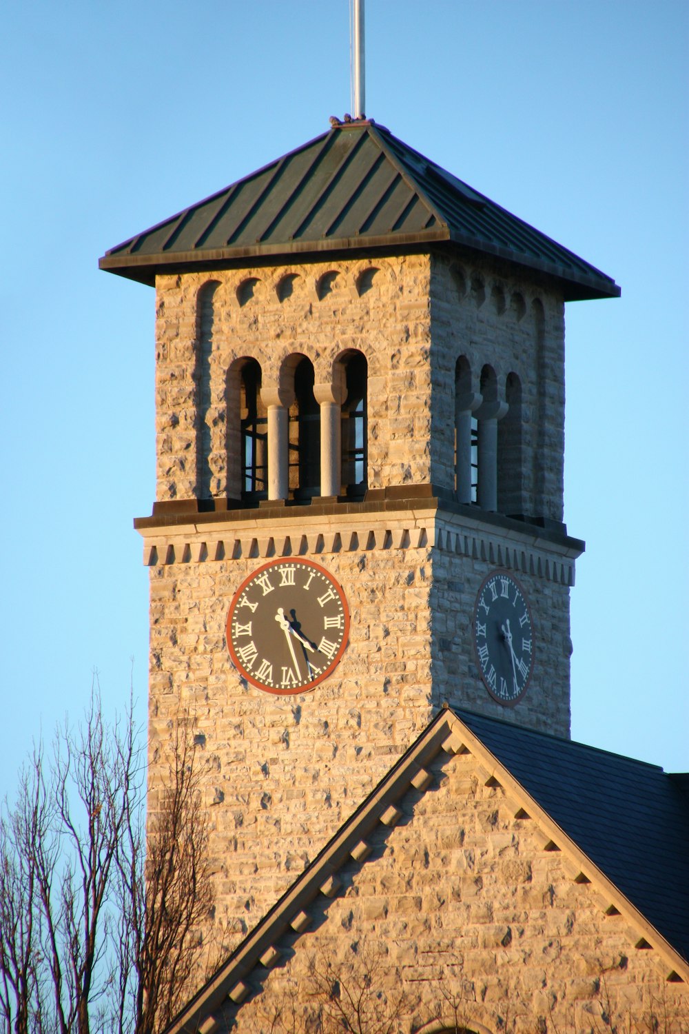 brown brick building with clock tower