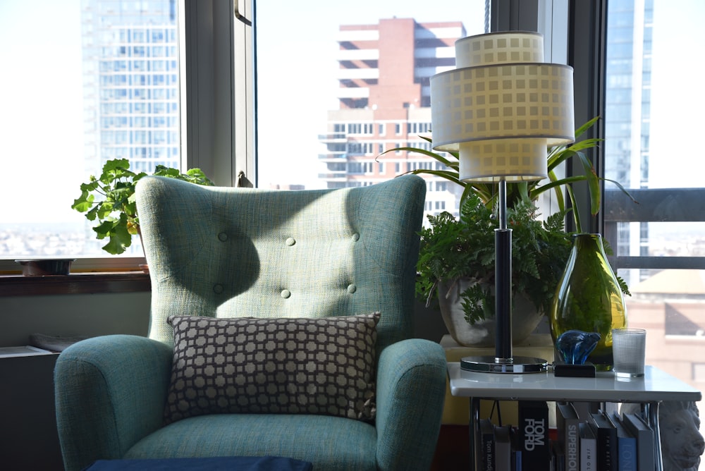 grey and white throw pillow on grey sofa chair