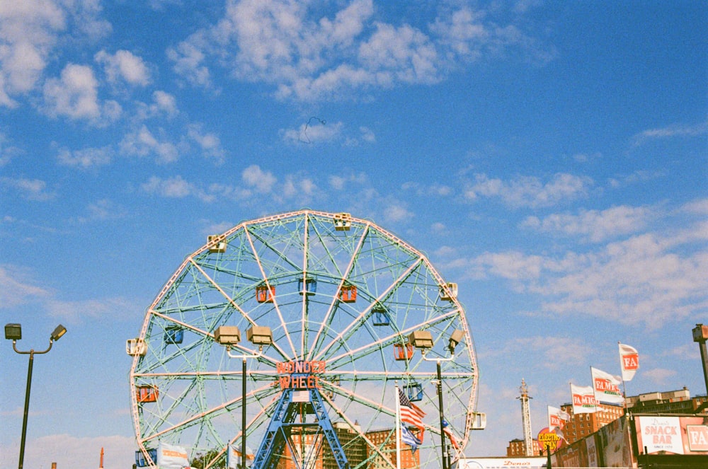 white ferris wheel under blue sky during daytime