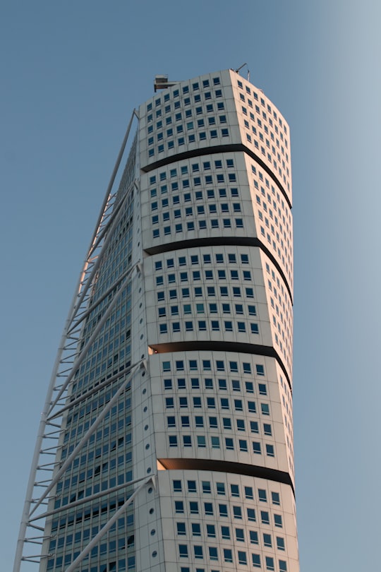 white and blue high rise building in Turning Torso Building Sweden