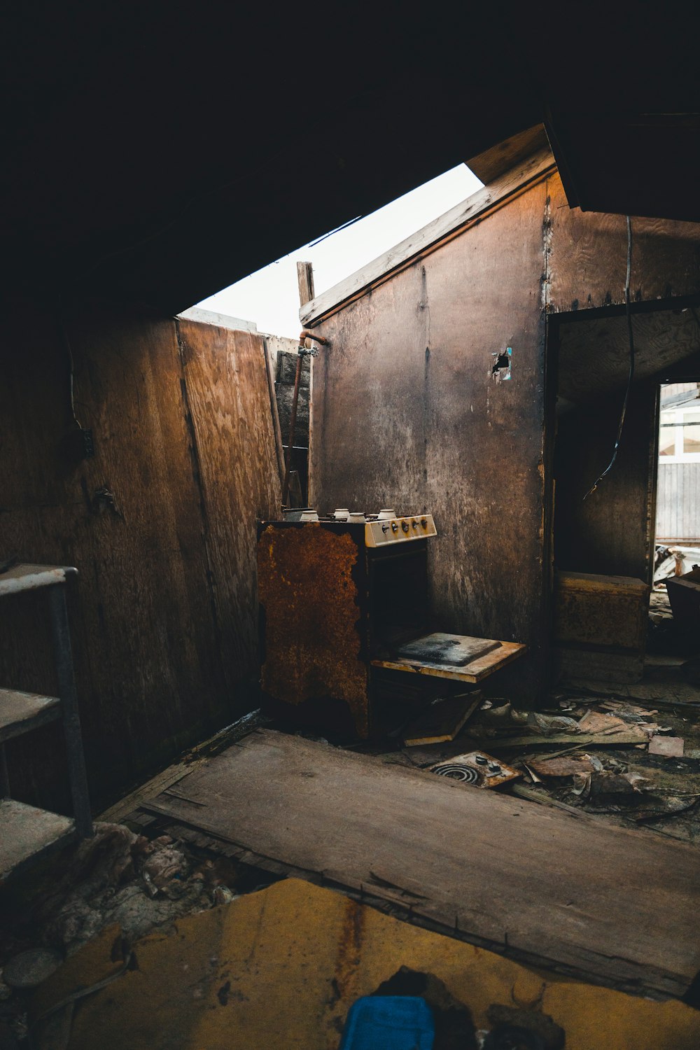 brown wooden door near white plastic chair