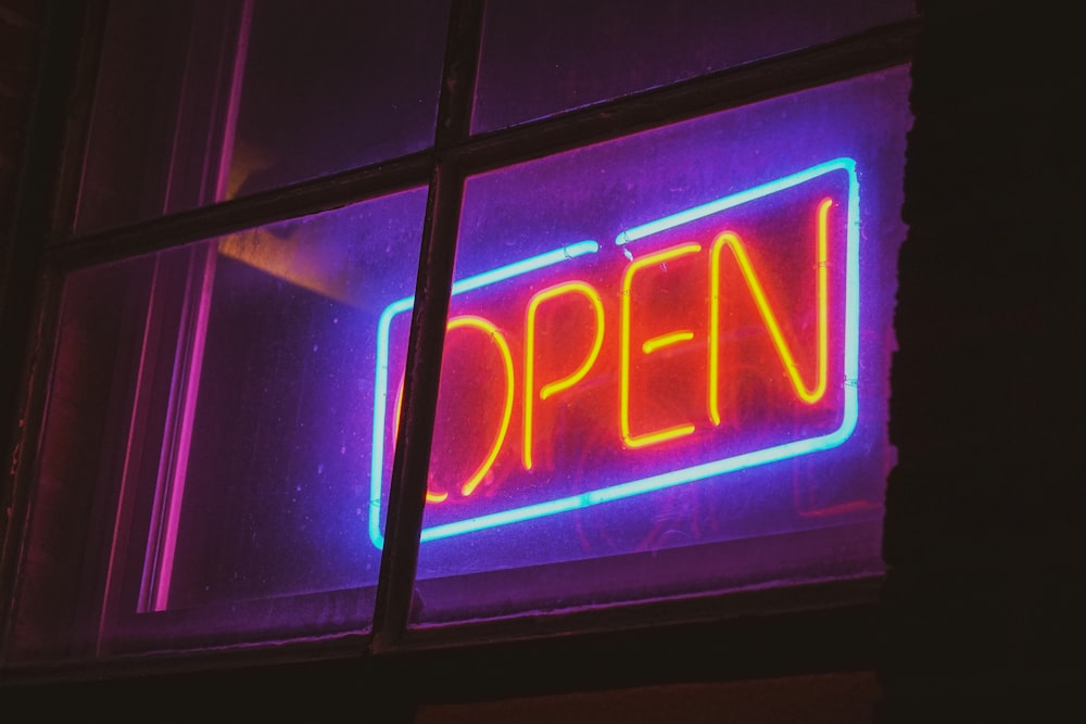 purple and yellow open neon light signage