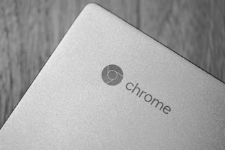 A sleek laptop screen showing the Chrome OS desktop with vibrant icons and a clean interface.