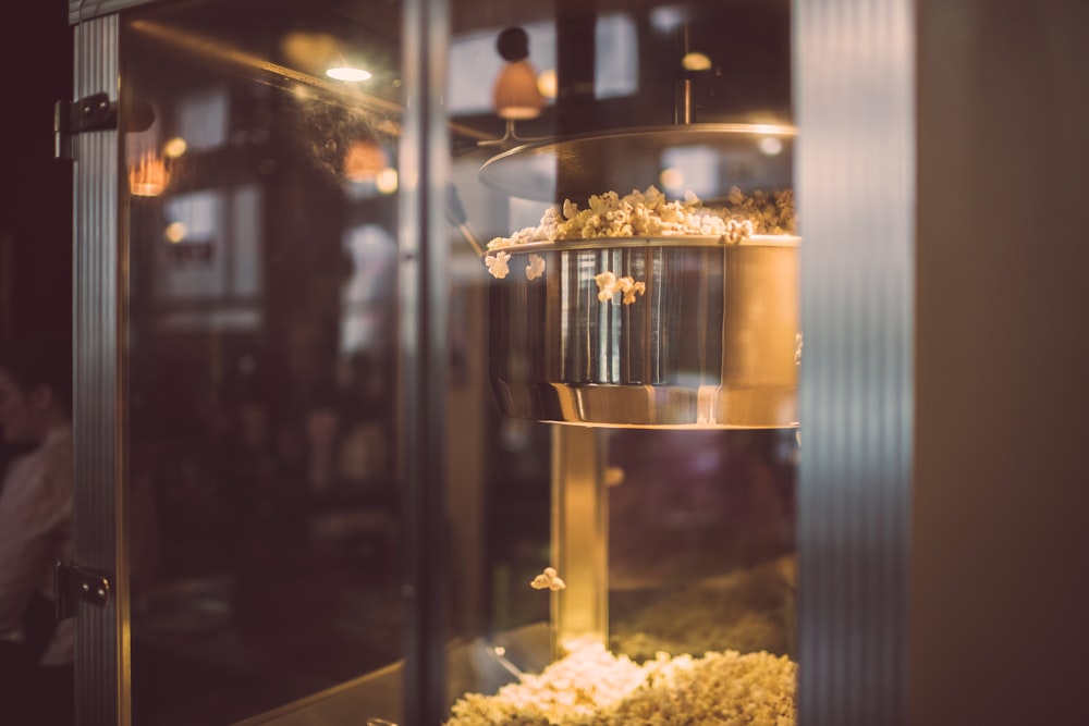 white popcorn on clear glass container