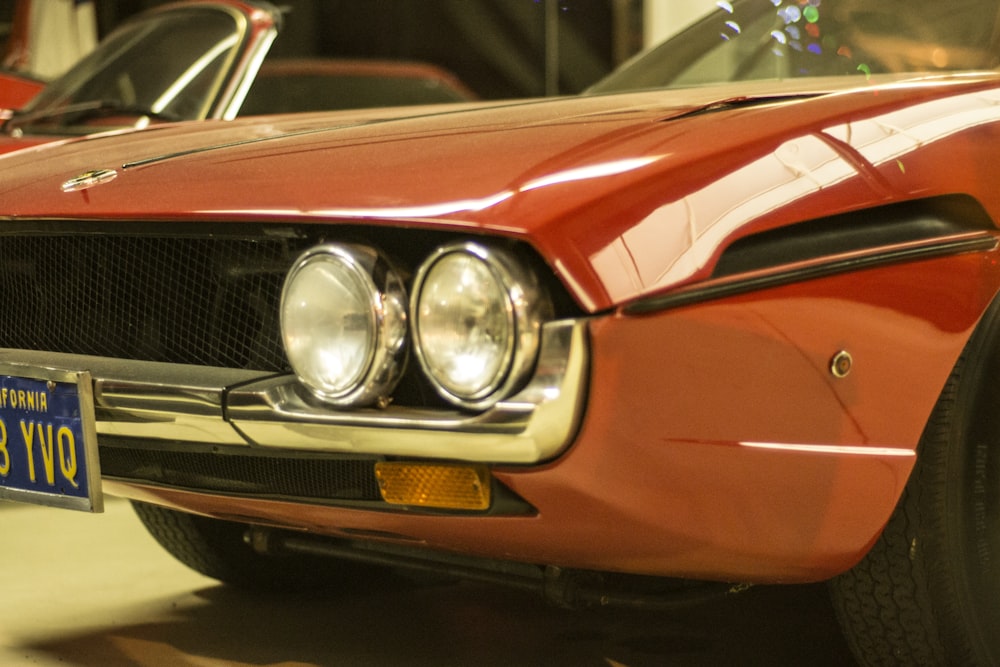 red and silver car in a parking lot