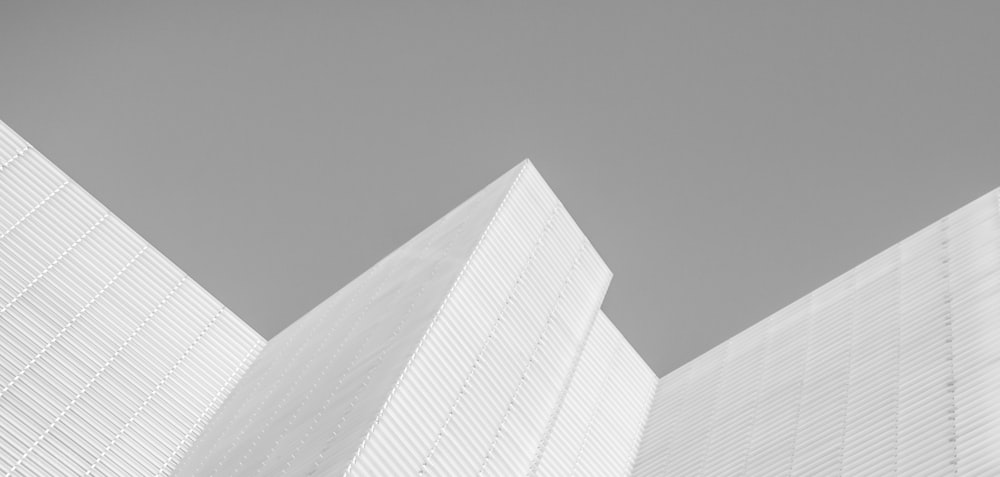 white concrete building in grayscale photography