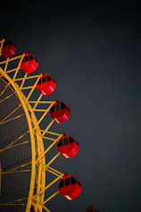 red and white ferris wheel under blue sky during daytime