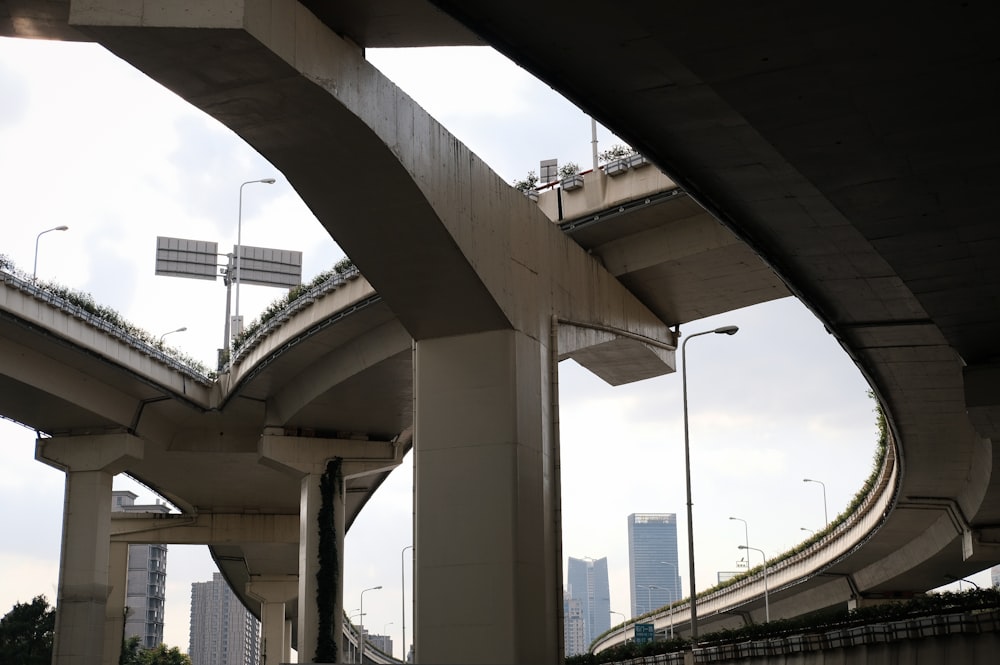 white concrete bridge over body of water during daytime