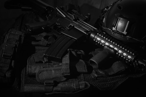 black assault rifle on black textile