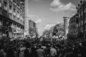 grayscale photo of people walking on street