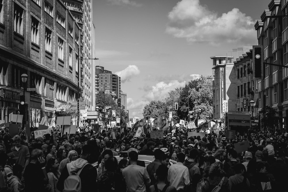 grayscale photo of people walking on street